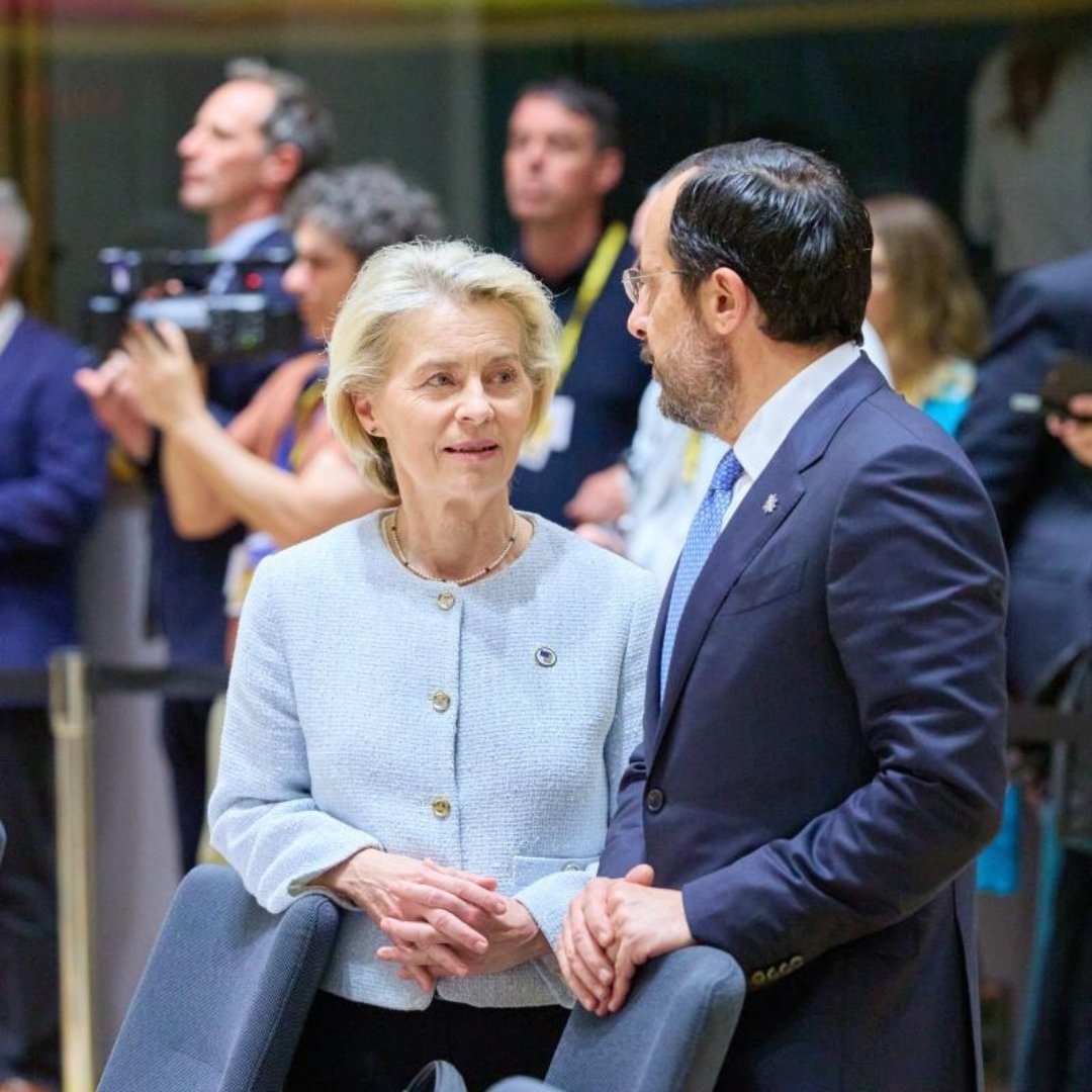 A medium close-up shot of Ursula von der Leyen and Cyprus President Nikos Christodoulides engaged in conversation 