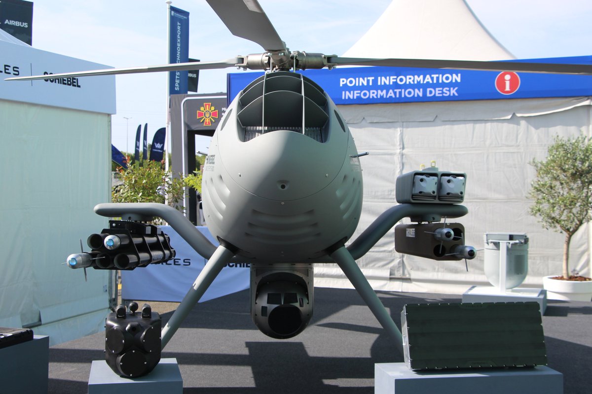 Lubos_Sramek's tweet photo. #Eurosatory2026: @ThalesDefence #firepower on @SchiebelGroup #CAMCOPTER S-301:
- starboard: 5 x FZ 275 70 mm laser guided rockets (#LGR)
- port: 2 x #Toutatis loitering ammunition + 4 x 68 mm laser guided rockets (#RGL)
Up to 80 kg of effectors on each side.
#CounterUAS https://t.co/4Zc9i9do5T