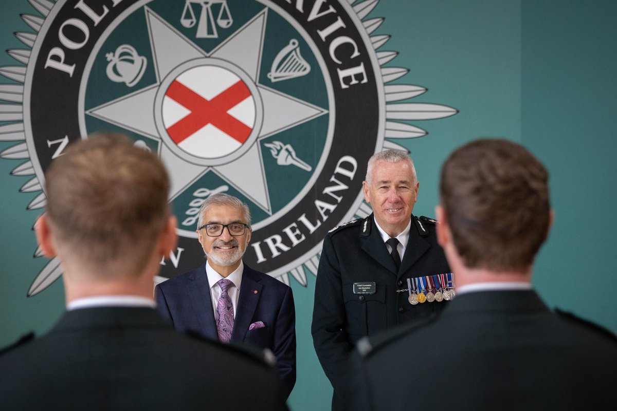 ChiefConPSNI's tweet photo. Chief Constable Jon Boutcher and @NIPolicingBoard Vice Chair Mukesh Sharma were delighted to attend today's attestation ceremony @PoliceCollegeNI. Congratulations to our 51 new officers as they take the next step in their policing career. https://t.co/BfPSk9LAU0