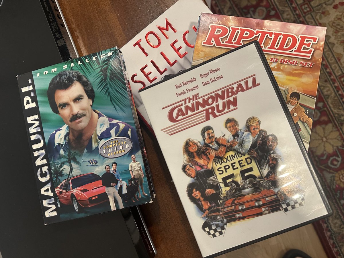 TL9645's tweet photo. @Ca30199057Chris @Super70sSports Blu-ray!!? Respect! (I've only got it on DVD ) On top of Simon and Simon DVD on top of a Tom Selleck memoir book. Sir you are my kind of people! Instant follow! 🫡 https://t.co/64N6jhB9pc