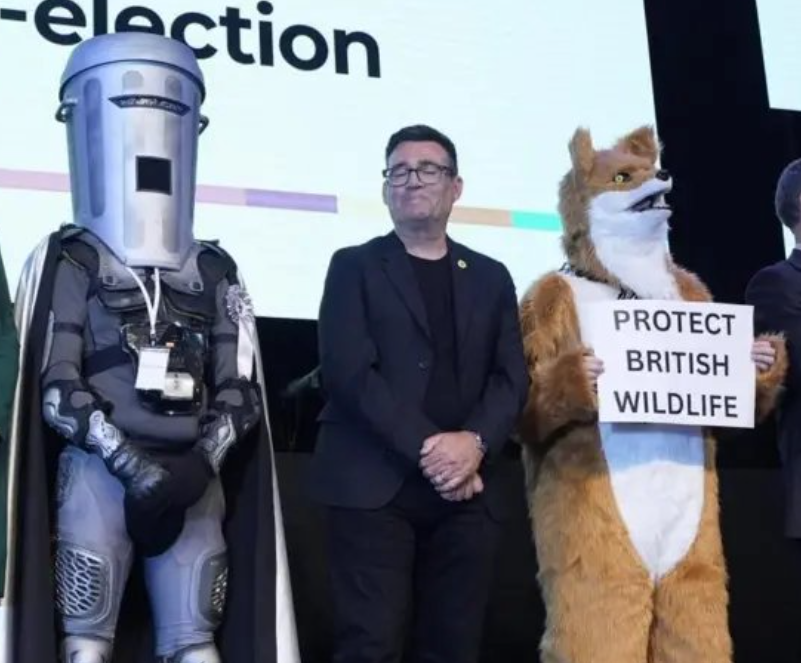 goatcel's tweet photo. me when i'm andy burnham and i'm stood between the dark lord of the recyclons from sigma IX and a fox who eats shit https://t.co/aVbEPIkjNz