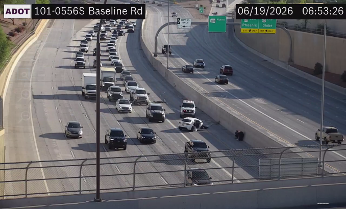 A traffic camera view of a crash on a highway.