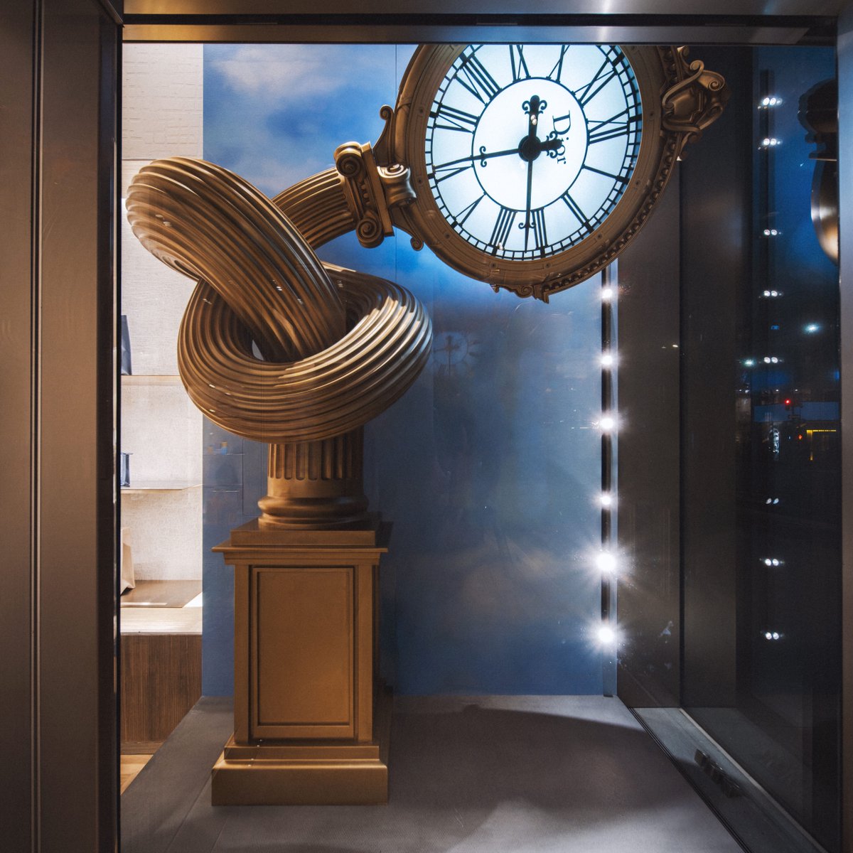 Dior's tweet photo. Artist Alex Chinneck reimagines urban icons from New York and Los Angeles as surrealist sculptures at their respective House of Dior locations. Come visit us to discover the nine works animating the windows on 57th Street, while five more continue the showcase in Beverly Hills.