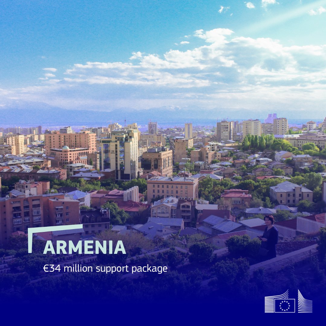 A promotional graphic featuring an elevated, wide-angle view of the city of Yerevan, Armenia, under a bright, partly cloudy blue sky with distant mountains visible on the horizon. In the lower right foreground, a woman stands among lush green terraces overlooking the cityscape. Text overlaid on the bottom-left reads: "ARMENIA. €34 million support package." The European Commission logo is displayed in the bottom-right corner.