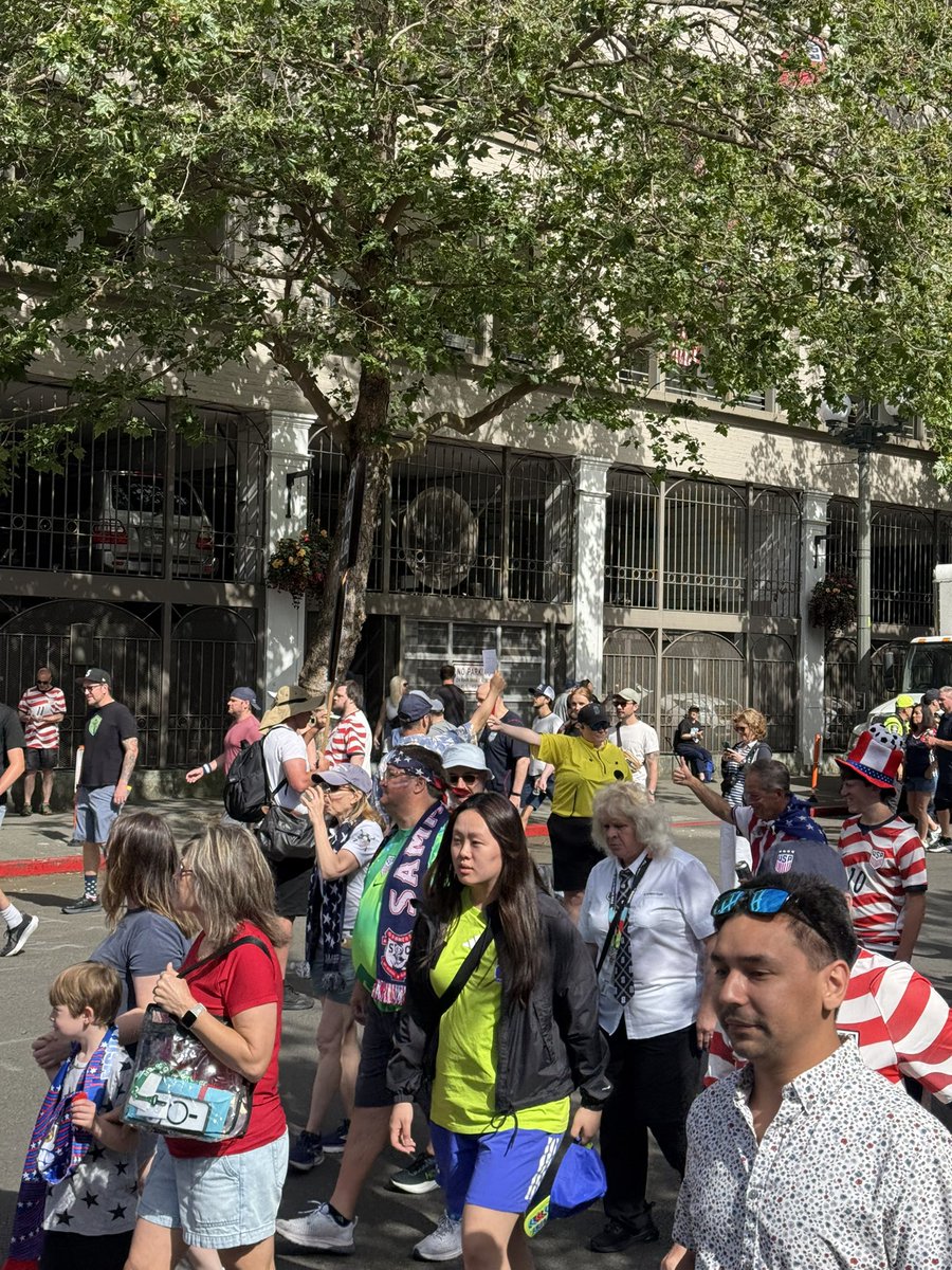 pnwprincess23's tweet photo. designated protest areas all over the seattle stadium vicinity, but all i’ve seen so far is a fan giving a red card to a doomsday preacher? https://t.co/FzncMdhLHN