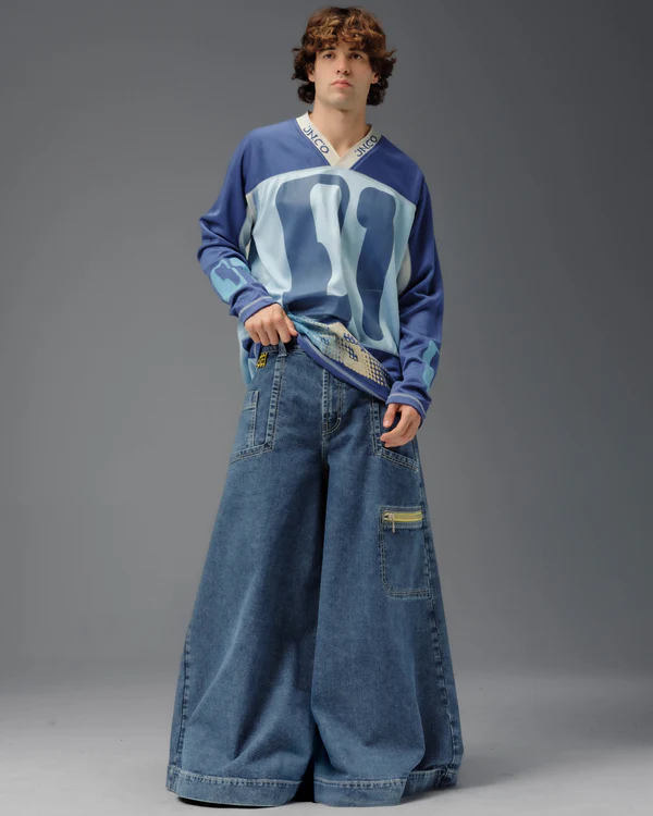Arkypatriot's tweet photo. Men's jeans have officially entered their "studio apartment" era. Brand name "Crime Scene Jeans" by JNCO  50" width leg opening.

These aren't pants. These are a 2-bedroom, 1-bath rental with room for a washer and dryer.

Are these fashion, or do they look like someone lost a fight with a denim circus tent?