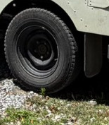 DSDoubleU2U's tweet photo. @WilliamShatner Look at the white spot on the top side of the back tire.  In the same position in both photos.  Even the lugs are in the same position.  Wouldn't happen if they were two different days. https://t.co/vMqFC5gsnW