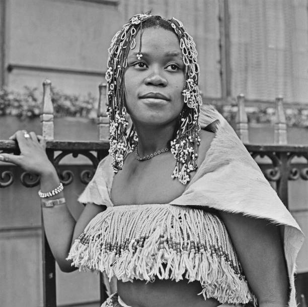 HistorySAZAR's tweet photo. Audrey Motaung (1952–2019) was a South African singer, composer, and percussionist. Born in Pretoria, she left her home country in the early 1970s as part of the pioneering multicultural rock band Jo'Burg Hawk and eventually settled in Germany, where she became a prolific, genre-spanning artist. Photo Credit: Evening Standard/Hulton Archive
