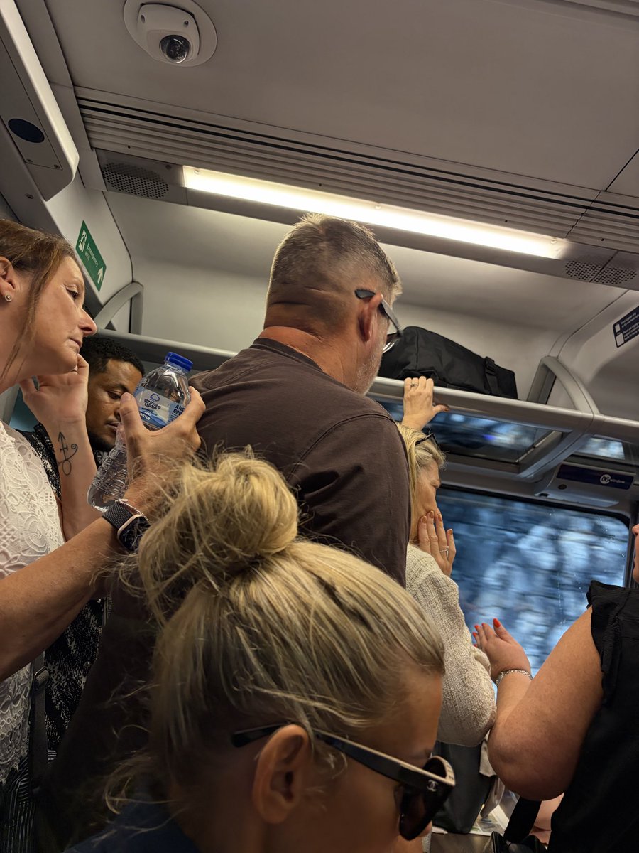 Gindiesel's tweet photo. @TPExpressTrains 

I’m in the 10:03 train from Meadowhall to Liverpool, and I have ti say you are a disgrace as a company, having booked 1st class I’m now in a carriage that is packed to walk to wall on a day in the mid 20s and full of disabled and infirm women and children https://t.co/lawqsMMoHP