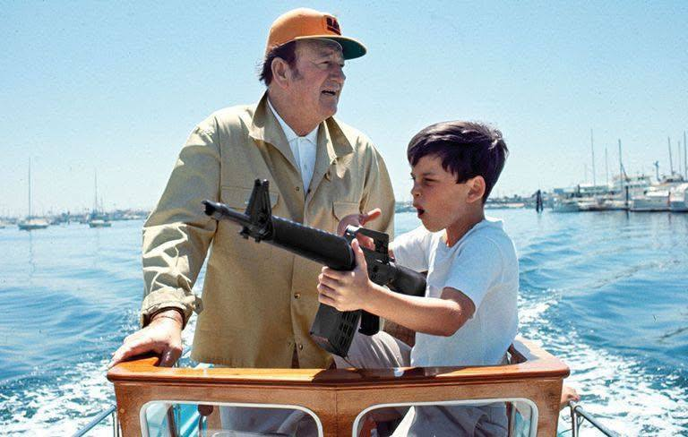 AK74respecter's tweet photo. Happy Father's Day to all the dad's out there, if you have a Dad don't forget to give him a  call today.

John Wayne and his son Ethan out for a boat ride in Newport California. Ethan is armed with a Mattel Marauder toy rifle. https://t.co/B8jkC0zCkB