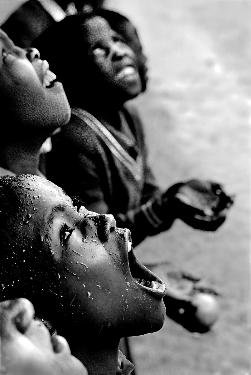 cameralab21's tweet photo. Chris Steele-Perkins - Lesotho, School children during a rainstorm,1981 https://t.co/H760BXAhQ4