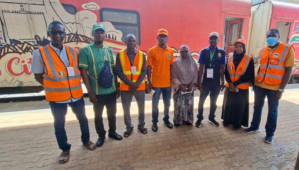 nemanigeria's tweet photo. NEMA Visits Nigerian Railway Corporation (NRC) to Strengthen Working Relationship

NEMA Operations Office, Kaduna paid a courtesy and working visit to the Nigerian Railway Corporation (NRC) at the Rigasa Railway Station, Kaduna, to strengthen existing collaboration and enhance emergency preparedness and response mechanisms.

The visit, led by the new Head of Operations, *Hajiya Halima D. Suleiman* , also provided an opportunity to formally introduce herself to the management of the NRC and discuss areas of mutual interest aimed at improving coordination during emergencies and disasters within the railway sector.

Speaking during the visit, the Head of Operations calls for closer collaboration between the organizations, noting that the occurrence of derailment and other train related accidents and emergencies makes synergy between NEMA and the NRC essential.

She stressed the importance of timely information sharing to enable NEMA respond promptly whenever the railway corporation experiences any form of emergency or distress situation.

The Head of Operations further mentioned importance of capacity development on emergency response among railway station personnel during railway incidents.

According to her, such training most especially in basic first aid will shape and improve the preparedness of the railway staff and also enhance the overall safety of passengers and railway operations.

On his part, the Station Manager of the Rigasa Railway Station, Kaduna *Mr. Kabiru Yakubu,* warmly welcomed the NEMA delegation and expressed appreciation for the visit.

He commended the Agency for its humanitarian and emergency response efforts, recalling an incident in which he was involved and NEMA personnel were among the first responders who assisted in saving lives and providing support.

He then described the proposed training and simulation exercises as timely and beneficial, assuring the NEMA team of the corporation's readiness to collaborate and work closely with the Agency. 

He expressed optimism about future engagements and partnerships aimed at strengthening emergency management and safety within the railway sector.

The visiting NEMA delegation was conducted round the NRC facilities and operational equipment, where they were briefed on the corporation's operations and inspected key facilities and equipment.

At the end, both organizations reaffirmed their commitment to sustaining a productive partnership geared towards safeguarding lives, property, and critical infrastructure.

 18:06:2026