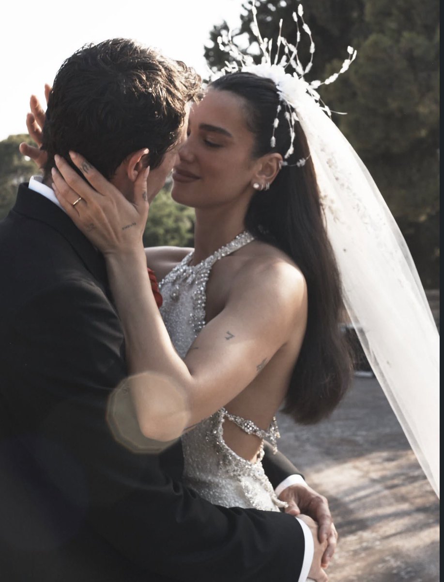 BuzzingPop's tweet photo. Dua Lipa and Callum Turner stun in new wedding photos. https://t.co/4EHvccOW81