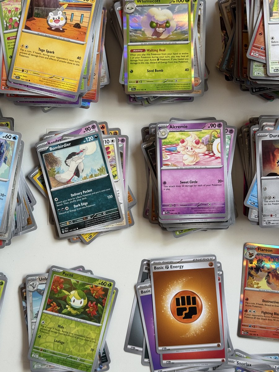 fearosaur's tweet photo. i’ve been throwing my pokemon bulk in a drawer and today i’m finally organizing it…. my back hurts https://t.co/A14LCkQjQJ