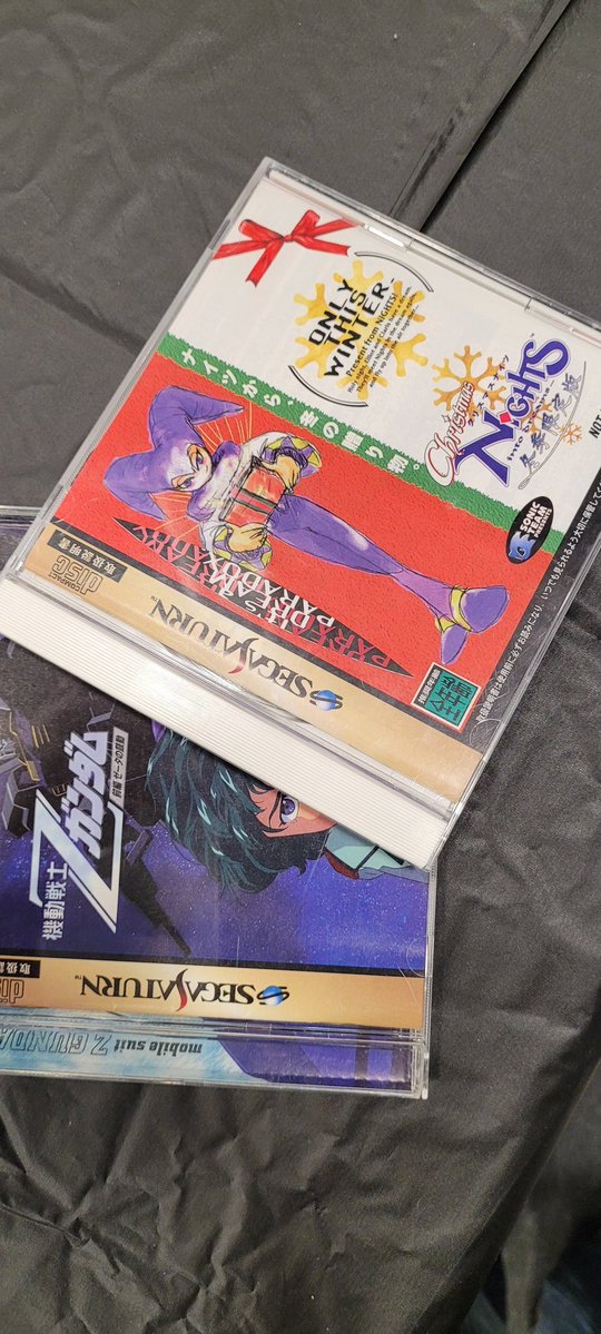 cainexodus's tweet photo. I bought a modded Saturn ages ago just for NiGHTS and I've never owned Christmas NiGHTS... until now! 🔥 Also got Zeta Gundam, why not! https://t.co/cGczV4VbEW
