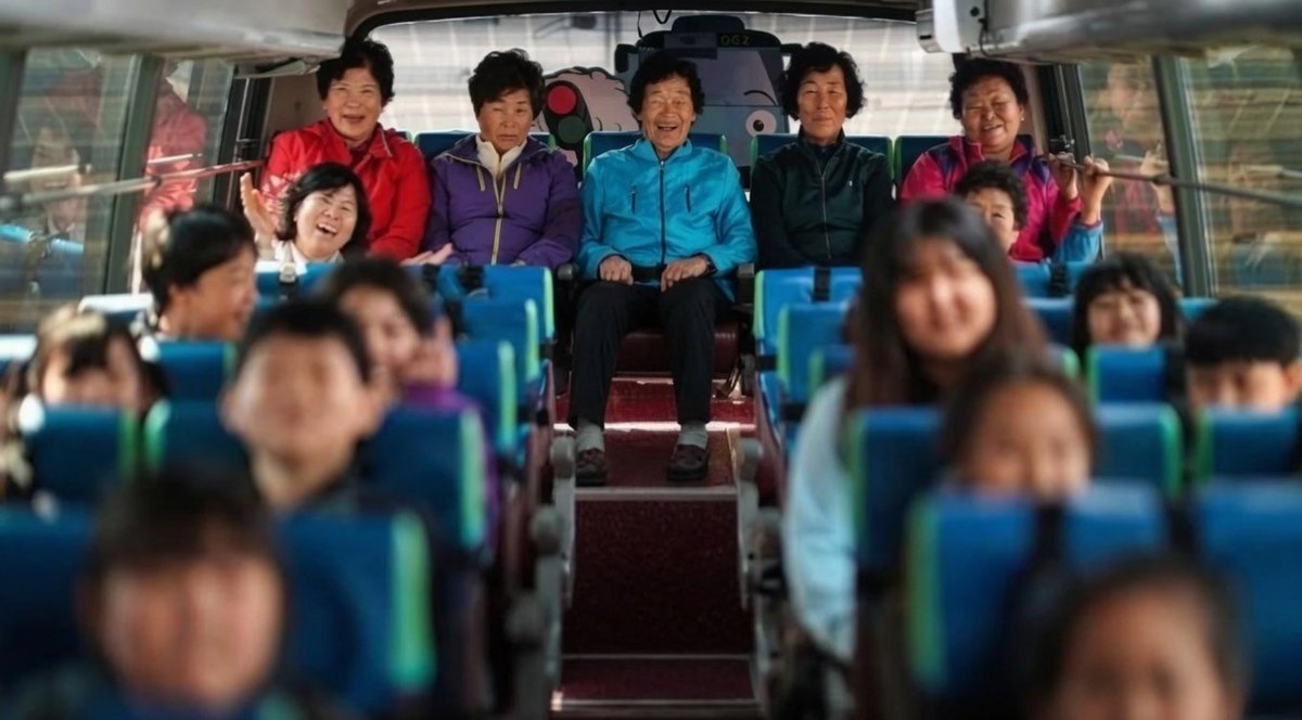 WolfofX's tweet photo. South Korea's rapidly declining birth rate has left many rural communities struggling to keep their schools alive. 

In Gangjin County, at Daegu Elementary School, classrooms once faced the possibility of growing quieter as fewer children were born and young families moved to larger cities.

Rather than allowing empty seats to define their future, the school welcomed an extraordinary new group of students: elderly women, many of them grandmothers in their 60s and 70s who had spent their entire lives wishing they could learn to read and write. 

As children, poverty, traditional expectations, and family responsibilities had denied them the chance to attend school.

The women now ride the school bus, sit in classrooms, practice reading and writing, share meals with younger pupils, and experience milestones they had dreamed about for decades. 

Their return to school has not only fulfilled lifelong ambitions but has also brought new energy to a community confronting population decline.