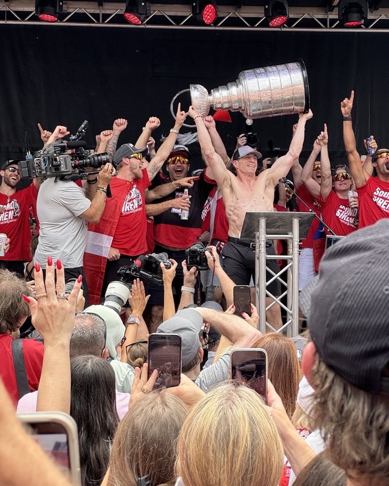 WakeGOV's tweet photo. Canes in six, the sirens sound,
Red and black flood all downtown.
Even David Ellis donned a cape for the day,
Wake County cheering, streets on display.
What brings 100,000 out today? π
#CanesInSix #TakeWarning #WakeCounty #StanleyCupParade #CanesCounty @Canes @RaleighGov @WakeCountyMgr ππ