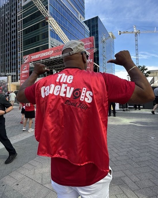 WakeGOV's tweet photo. Canes in six, the sirens sound,
Red and black flood all downtown.
Even David Ellis donned a cape for the day,
Wake County cheering, streets on display.
What brings 100,000 out today? π
#CanesInSix #TakeWarning #WakeCounty #StanleyCupParade #CanesCounty @Canes @RaleighGov @WakeCountyMgr ππ
