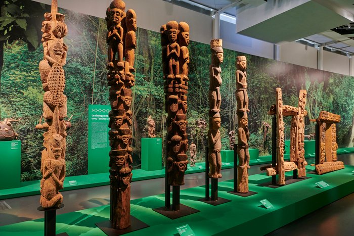 OvercomeXX's tweet photo. Royal Architecture of the Western Highlands of Cameroon

the Bamiléké and Bamum kingdoms integrated genealogical and political archives directly into the architecture of their royal palaces. These structures featured massive wooden support pillars carved with vertical stacks of human and animal figures. These carvings created a physical record of descent and authority.

The human carvings mapped ancestral lineages, while the zoomorphic figures specifically the elephant, leopard, and buffalo represented the attributes of the ruler. These animal motifs served as emblems of strength and wisdom, signaling that the Fon's power was rooted in both lineage and spiritual capability.

These pillars converted the palace into a public proof of legitimacy.