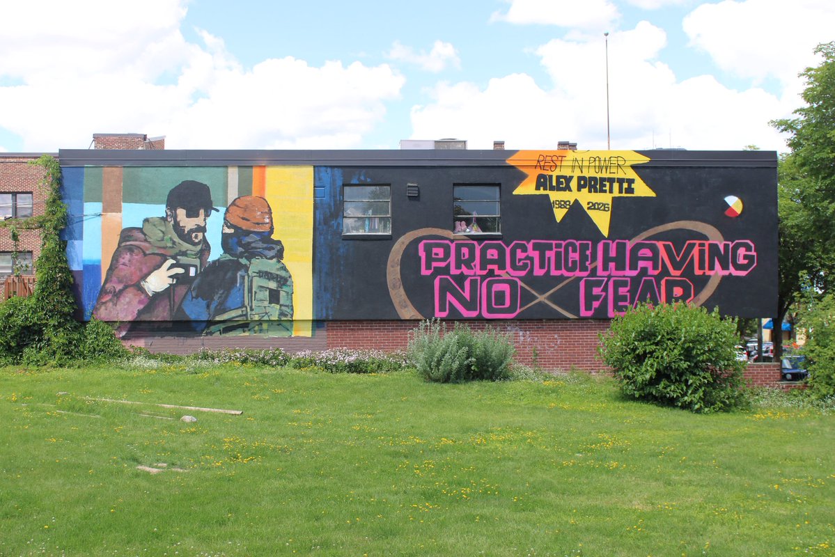 taylr's tweet photo. the “practice having no fear” mural of alex pretti on nicollet ave in minneapolis is finished, a few blocks north of where he was killed by border patrol during operation metro surge. inclusion of a medicine wheel makes me wonder if it’s a native artist, couldn’t see signature https://t.co/ZCIa9xTDdm