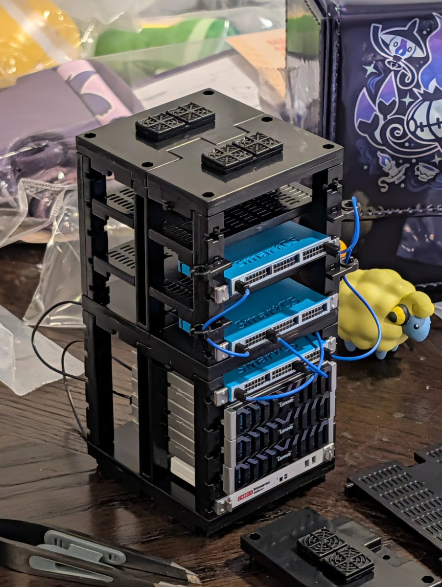 Wunkolo's tweet photo. Back from Japan and spammed the miniature server rack capsule machines https://t.co/NKqTJZ5rso