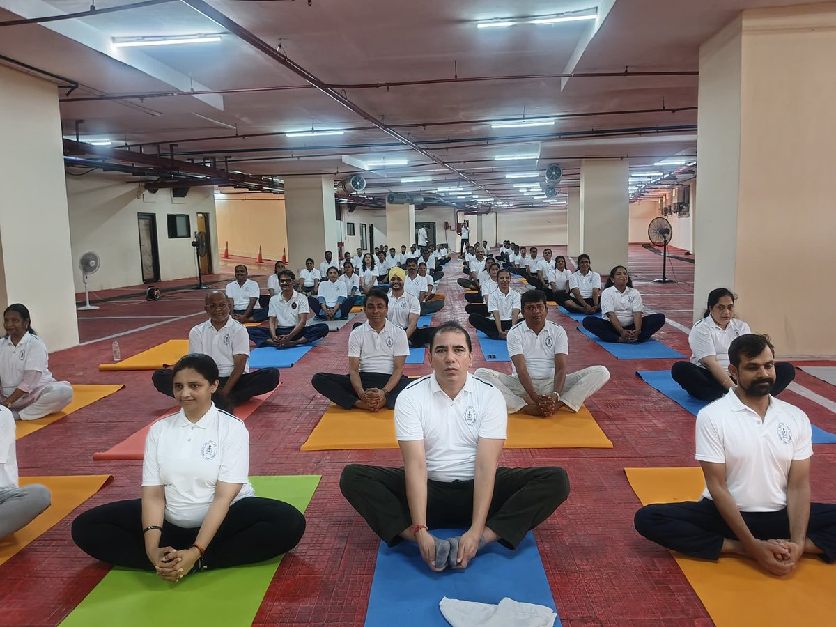 IN_DCP's tweet photo. The 12th International Day of Yoga was celebrated at HQWNC on 21 Jun 26 for Civilian Defence Employees. The event was conducted in coordination with yoga professionals from Kaivalyadhama, Shri Deepak Binjola and Shri Viraj Nayan Dhotre. CCPO, along with approximately 80 civilian personnel, participated with great enthusiasm, embracing this year’s theme, “Yoga for Healthy Ageing”, and promoting the spirit of fitness, mindfulness, and holistic well-being. #InternationalDayOfYoga2026 #YogaForHealthyAgeing