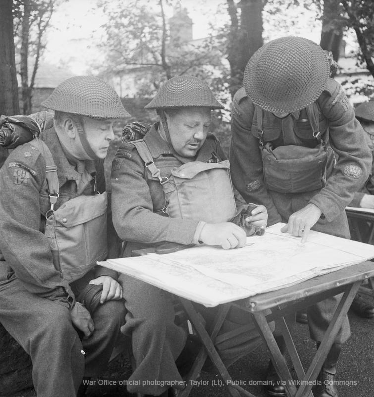 VeteransFdn's tweet photo. Men of the Cheshire Home Guard manning a 6 pdr naval gun mounted on a field gun chassis at Hoylake on the Wirral, consult a map at Battery HQ, 1 June 1943. https://t.co/CjyYgXB1Dq