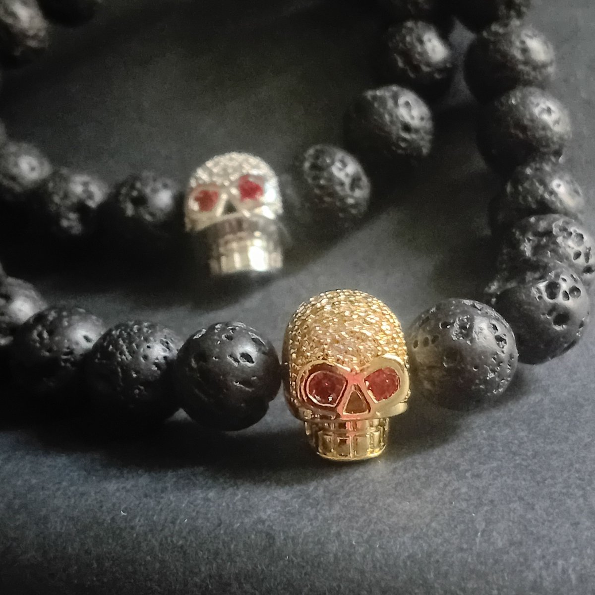 pinpaperstudio's tweet photo. Forged by fire. Inspired by darkness.

Our Lava Stone Skull Bracelets pair natural volcanic stone with crystal skull accents in Gold, Silver, or Black finishes.

Which one is your favourite?

#SkullBracelet #LavaStone #AlternativeFashion #GothicStyle #PinAndPaperStudio https://t.co/1xJRWOMzA9
