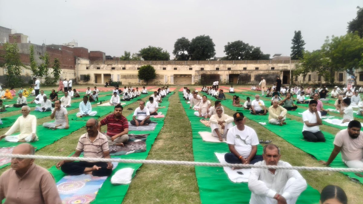 ShamliNagar's tweet photo. June 21, 2026, the 12th International Yoga Day was celebrated in the V.V.Inter College park with great enthusiasm and dignity. Administrative officials including the District Magistrate, Sub-Divisional Magistrate, and the Executive Officer of the NPP—along with respected citizens https://t.co/6swSfmm3Ok