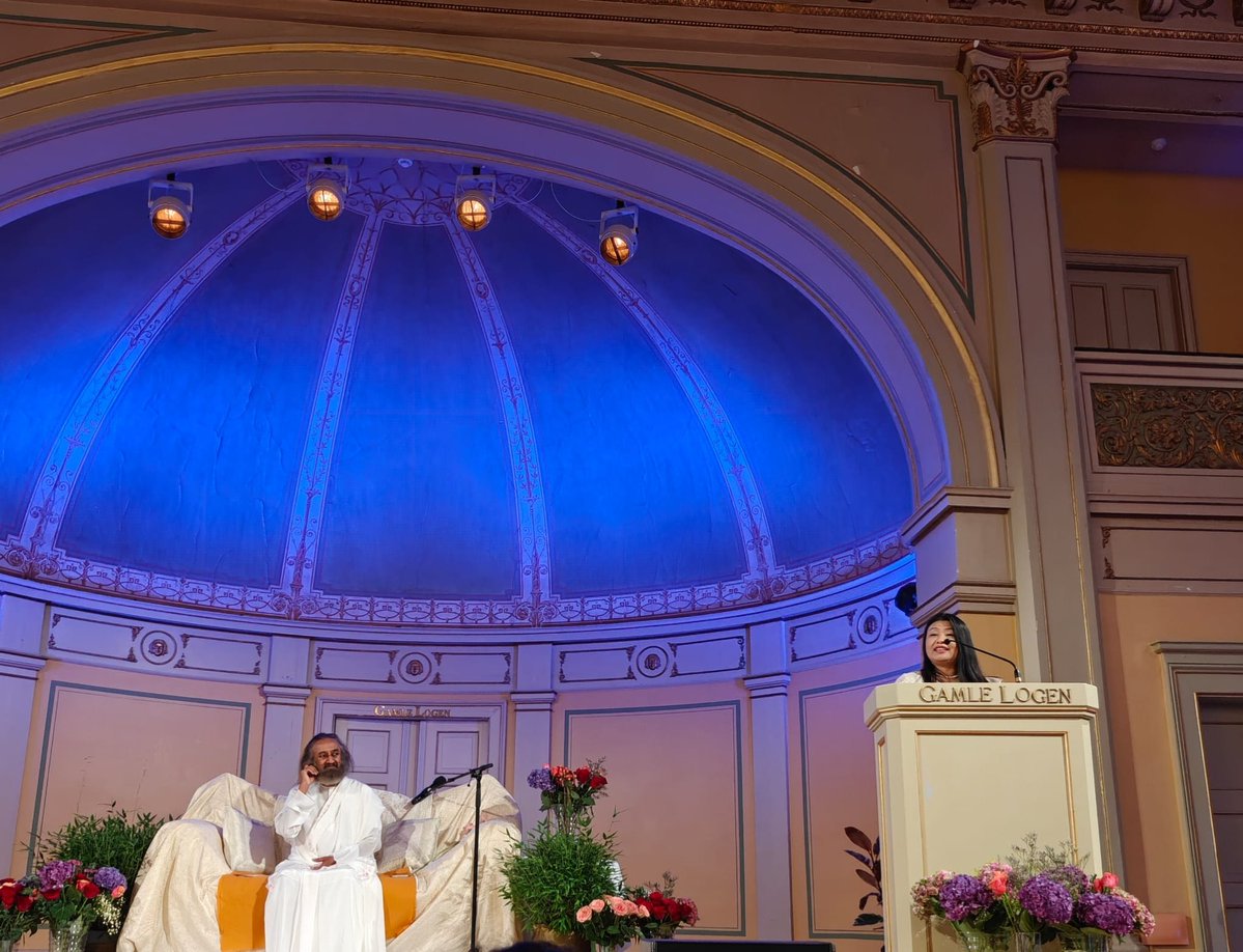IndiainNorway's tweet photo. Ambassador H.E. @gloriagangte attended “Building Bridges: An Evening on Wellbeing, Leadership and Humanity’s Future” in Oslo, featuring Gurudev Sri Sri Ravi Shankar, globally renowned humanitarian and peace ambassador, in conversation with Erik Solheim, former Norwegian Minister and senior UN leader.

In her remarks, Ambassador spoke about “ Yoga for Healthy Aging”- the theme for UN International Day of Yoga 2026 and highlighted that millions have benefited from the holistic approach to health that Yoga provides. 

The Ambassador also commended Gurudev Sri Sri Ravi Shankar for his unwavering commitment to peace, dialogue, and conflict resolution, describing him as a global ambassador of peace whose work has reached different continents of the world.

During the discussion, Gurudev emphasised that humanity and trust are among the most essential values needed in today’s world, underscoring the importance of fostering understanding, compassion, and mutual respect as foundations for a peaceful and sustainable future.

Thanks to “Art of Living” for bringing together distinguished guests, community leaders, and members of the public for thoughtful discussions on a contemporary topic.
#GamleLogen
@ArtofLiving @ArtofLivingIC @ErikSolheim
@IndianDiplomacy @PMOIndia @PIB_India @norwayinindia