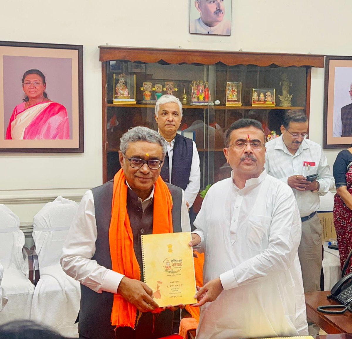 SuvenduWB's tweet photo. A Historic First Step Towards a Golden Bengal.

Today is a momentous day for every citizen of West Bengal. I extend my Heartfelt Congratulations and deepest gratitude to our Finance Minister, Shri Swapan Dasgupta (@swapan55), for presenting a truly visionary and landmark First Budget for our Government.

This is not just a Financial Statement; it is a master blueprint that will unequivocally propel West Bengal from the depths of the 'economic abyss we inherited', towards a Golden Future. For far too long, our immense potential was stifled. Today, we have charted a definitive roadmap to not only match the glorious past of West Bengal but to shatter every glass ceiling and limitation holding us back. We are building a progressive, unstoppable State that will stand out as the primary contributor to India’s growth story and serve as a core driver of the Viksit Bharat vision.

We are bringing in a culture of entrepreneurship, innovation and unwavering support for our citizens. Here are a few transformative highlights from today’s historic Budget:
✅ Massive Employment Push: We are fulfilling our promise by filling 1 Lakh Government vacancies this financial year, while ensuring a historic 33% reservation for Women.
✅ Empowering Nari Shakti: ₹36,000 crore has been allocated for the Annapurna Yojana, providing ₹3,000 in monthly financial assistance to eligible Women.
✅ Justice for State Govt Employees: A massive 20% hike in Dearness Allowance (DA) for our hardworking State Govt Employees and Pensioners, bringing the total DA to 38% effective October 1.
✅ World-Class Infrastructure: We are establishing a new Greenfield Airport near Kalyani and an integrated Deep-Sea Port at Dadanpatrabarh in Purba Medinipur district to supercharge our regional economy.
✅ Industrial Revival: We have reintroduced crucial incentives with a ₹5,000 crore allocation for Industries, and we will be re-examining the Urban Land Ceiling Act to attract mega private investments.
✅ Youth & Rural Welfare: Allocating ₹14,000 crore for rural jobs under the VB-G RAM G scheme, increasing work days to 125, and providing monthly allowances for Unemployed Graduates.

This budget proves our absolute commitment to restoring West Bengal's lost glory and ensuring prosperity and dignity of every Citizen. The foundation for a robust, industry-friendly and progressive West Bengal has been laid.
Together, let us march towards a glorious Viksit Bengal. 
@BJP4India @BJP4Bengal