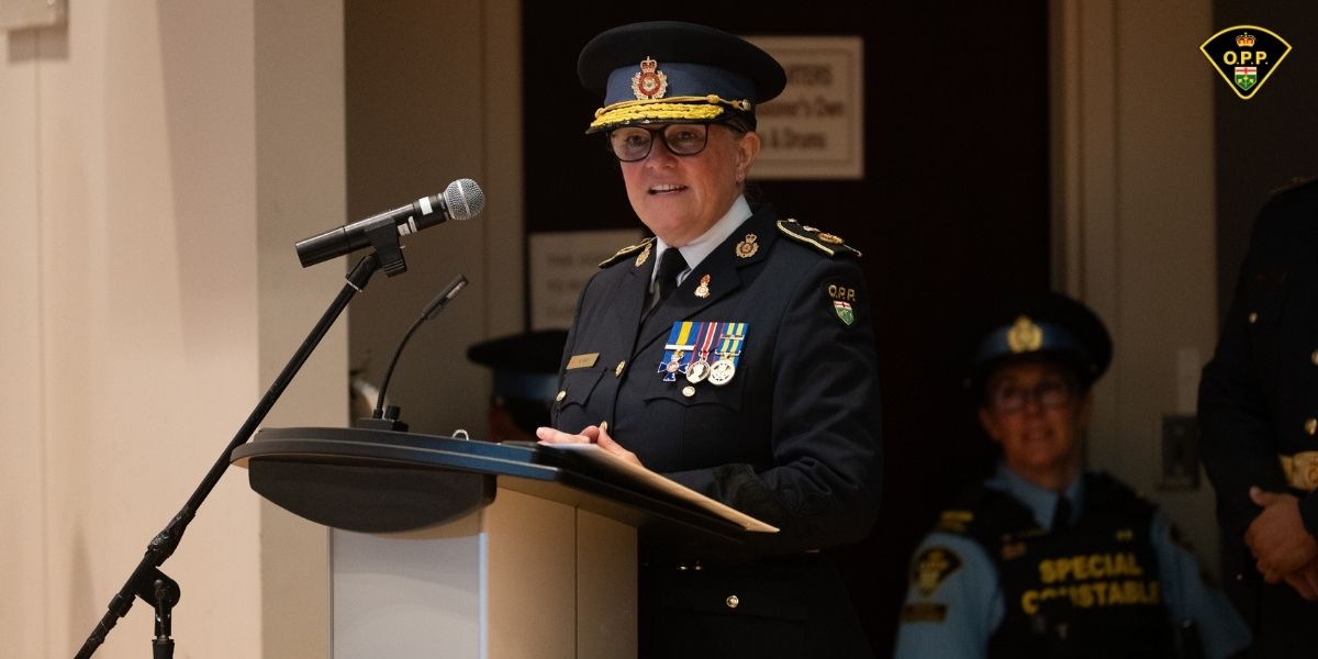 OPP Deputy Commissioner Dart delivers remarks at a podium.