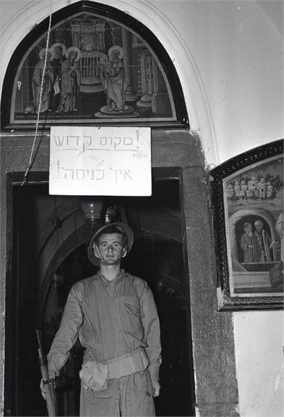 RabbiPoupko's tweet photo. "A HOLY SITE; DO NOT ENTER"

In 1948, the San Simon Monastery in the Qatamon neighborhood of Jerusalem was illegally occupied by Nazi Wehrmacht graduate and Palestinian militia leader Fawzi al-Qawuqji and his militia men. 

During Operation Yevusi, Palmach forces of the Harel Brigade assaulted the monastery on the night of April 29–30, 1948, in fierce close-quarters fighting.

Once they defeated the Palestinian and Nazi Wehrmacht-led soldiers, Zionist forces restored and preserved the religious nature of the church, giving it a special guard, and writing: "holy place, not entrance".

Zionism is the only force in history that has secured the rights of all faiths to coexist in peace in Jerusalem, something for which all faiths should be thankful to the state of Israel. 

Photo: Lazer Dinar, JNF archives.