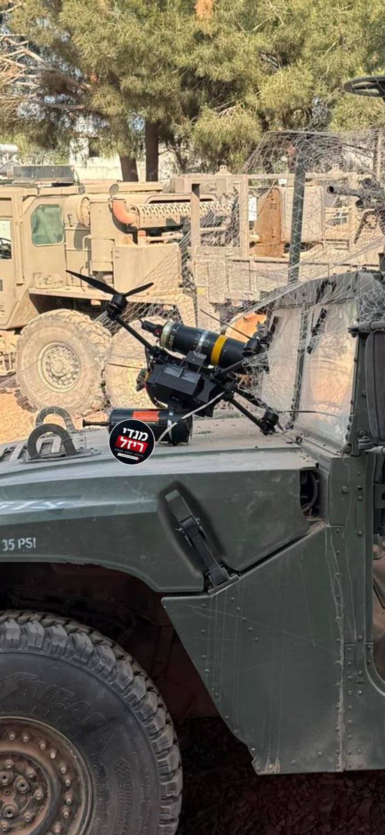 GrandpaRoy2's tweet photo. A Hezbollah fiber-optic FPV armed with the shaped-charge warhead removed from a Milan ATGM was stopped by the protective netting of an IDF armored vehicle. https://t.co/cobPuvHWmk