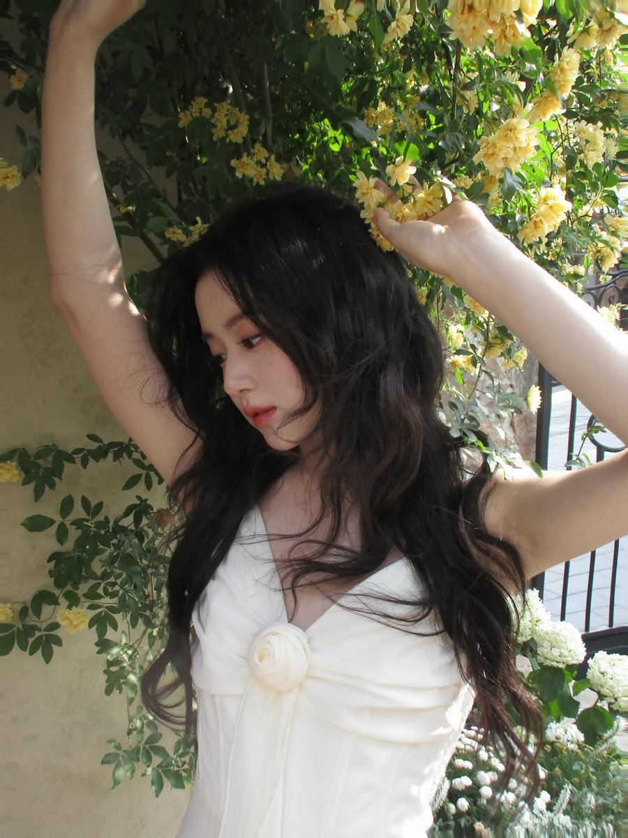 Dolliething's tweet photo. The white dress I wear blends into the softness around me, while the greenery and blooms frame me like I’ve stepped into a living garden painting—light. https://t.co/Inoq2BZbjG