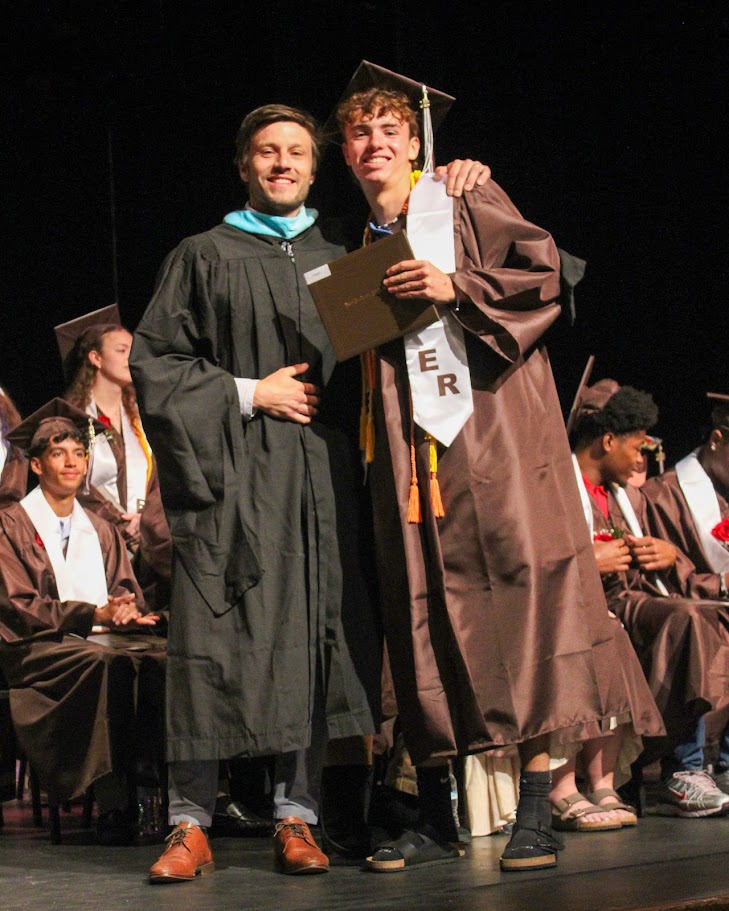 ERBomberstrack's tweet photo. Congrats to the @ERBombers Class of 2026! ER has a tradition of students selecting a school employee (teacher, coach, admin.) to present their diploma. I am honored to continue the "baton pass" to two of my guys! https://t.co/oXfSSNSMVS
