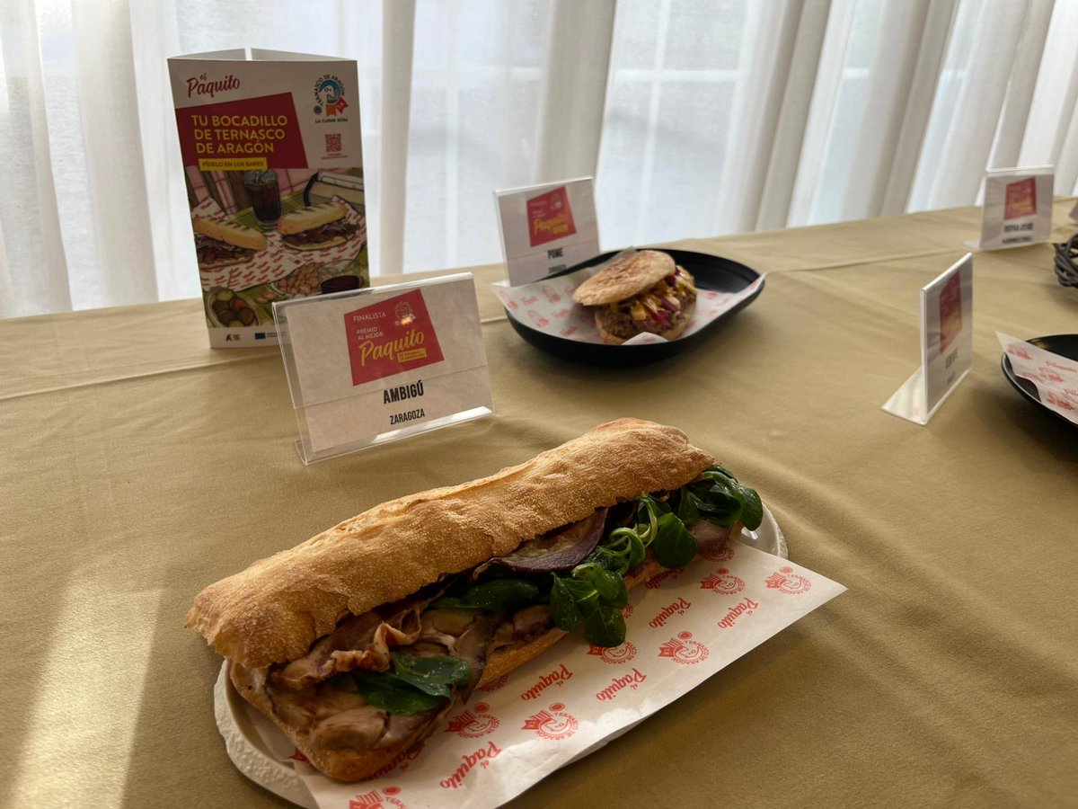 GobAragon's tweet photo. 🥪El Paquito Tonnato de El Ambigú gana el premio al Mejor Paquito de Ternasco de Aragón 2026.

➡️ La consejera Arancha Simón ha participado en la entrega de premios de un concurso que este año ha reunido 74 propuestas en 22 localidades aragonesas.

https://t.co/PdPbNezoSK https://t.co/lzraAyqSLF