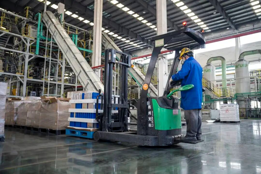 ChinaScience's tweet photo. Recycling process: transforming black mass into battery materials

Industry projections indicate that China generated nearly 400,000 tons of end-of-life electric vehicle (EV) power batteries in 2025, with that volume expected to surpass 1 million tons by 2030.
 
What happens to these batteries once they reach end-of-life? A recent visit by People's Daily reporters offers a closer look.

Trucks laden with retired EV batteries arrive daily at an integrated circular economy industrial park managed by Brunp Recycling, a holding subsidiary of Chinese battery giant CATL. Located in the Yichang Hi-tech Industrial Development Zone in Yichang, central China's Hubei province, this is where these batteries begin a new journey through the recycling chain.

"Upon arrival, retired batteries are sorted and stored according to their models, conditions, and sources," said Chen Zhaozhe, production manager at Yichang Brunp Recycling Technology Co., Ltd. The company recycles more than 150,000 tons of power batteries annually.

Inside the storage area, rows of battery packs were neatly stacked. "All these power batteries have degraded to less than 80 percent health," Chen noted. "They suffer slower charging speeds, reduced driving range, diminished power output, and elevated risks of thermal runaway."

Historically, gaps in battery management sometimes allowed end-of-life batteries to re-enter the market. Others ended up in unauthorized workshops with inadequate facilities and recycling technologies, posing significant safety and environmental risks.

To address these issues, China launched a national traceability information platform for new energy vehicle power batteries on March 31 this year. Every battery is now required to have its digital identification number recorded throughout its entire lifecycle from manufacturing and vehicle installation to operation, maintenance, retirement, and recycling.

"This not only helps ensure that we follow standardized procedures, but also allows vehicle owners to track where their batteries ultimately go," Chen said. "That increases their willingness to sell retired batteries to authorized recyclers."

The company has established a comprehensive traceability system that tracks every stage of the recycling process, from incoming materials and production procedures to final product shipments.

Once a battery's digital identity is verified, the retired pack moves to an automated dismantling line. Robotic arms skillfully remove the outer casing, revealing densely packed, brick-sized battery cells inside.

These cells, still potentially unstable, undergo a complete discharge process first to reduce their voltage to safe levels.

Following discharge, the cells are processed in crushing equipment, breaking them into uniformly sized fragments. The resulting mixture enters a nitrogen-protected furnace for high-temperature pyrolysis. Subsequent procedures, including dispersion, screening, and sorting, separate constituent materials such as casings, copper, and aluminum.

"Some of these separated materials can be reused directly," said Wang Hao, technical director at Yichang Brunp Recycling Technology Co., Ltd. "What remains is a high-purity black powder known as black mass."

This "black mass" is the most valuable material recovered from the cell, containing concentrated quantities of high-value elements such as lithium, nickel, cobalt, and manganese -- the critical raw materials for future batteries.

In the hydrometallurgical workshop, the black mass is fed into enormous reaction tanks and mixed with specially formulated acidic solutions. Under carefully controlled conditions, an intense chemical reaction takes place. The solid black mass dissolves completely, and its metal elements enter the solution in ionic form, creating a complex "metal soup."

For years, a major challenge in the industry was efficiently and accurately separating and purifying individual metals from this intricate mixture. 

"Traditional recycling methods often suffered from low recovery rates, poor product purity, high energy consumption, and the generation of large amounts of difficult-to-treat waste residue," Wang said.

To overcome these limitations, the company developed a direct recycling technology. Using this process, the combined recovery rate for nickel, cobalt, and manganese reaches 99.6 percent, while lithium recovery reaches 96.5 percent.

After passing through multiple processing stages, the dissolved black mass is ultimately transformed into high-purity lithium carbonate and iron phosphate. These newly regenerated raw materials can then be transported directly via pipelines or short-distance logistics to nearby downstream battery manufacturing facilities located just across the road.

"The iron phosphate and lithium carbonate supplied by Brunp Recycling are precisely blended and processed to manufacture new high high-performance lithium iron phosphate cathode materials," said Shi Jiang, head of the cathode materials division at another company under Brunp Recycling.

Compared with battery materials produced from newly mined ores, the next-generation lithium iron phosphate batteries made with recycled materials deliver outstanding performance.

"EVs equipped with these batteries offer faster charging speeds and longer driving ranges," Shi said. "They are better able to meet market demand for fast charging, extended range, and greener, lower-carbon transportation."

The full regeneration cycle from discarded battery pack to new raw cathode materials takes just a week.

In recent years, the industrial park has also established a closed-loop system of reverse product design. Lessons learned from the recycling process are fed back to battery manufacturers, helping them design batteries that are easier to recycle.

"For example, we recommend optimizing battery pack structures so they can be dismantled more easily through automated processes after retirement," Chen explained. "We also suggest adjusting the composition of certain metal materials so they can be separated and purified more efficiently during future recycling." (By Wu Jun, People's Daily)