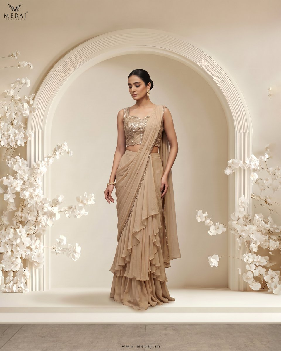 MerajCouture's tweet photo. Soft, fluid, and effortlessly elegant, this champagne toned draped saree features delicate layers with a beautifully embellished blouse. 

Find out more- https://t.co/nXWdEB69Yx

#weddingwear #saree #fashion #merajcouture https://t.co/uQm3q49EmY