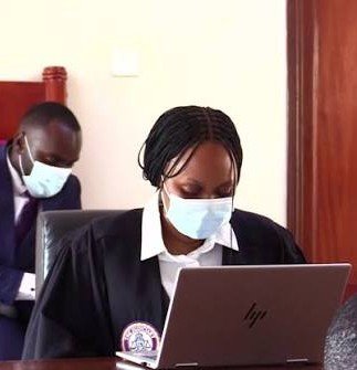 Lmc_89's tweet photo. SARAH BASEMERA ANNE : 

was on national TV last year preaching rule of law to the nation,  fast forward today she is covering her face and keeing an innocent &amp; frail Erias Lukwago in prison. #FreeEriasLukwago 
#FreeUgandaNow https://t.co/sv1hWZifDQ