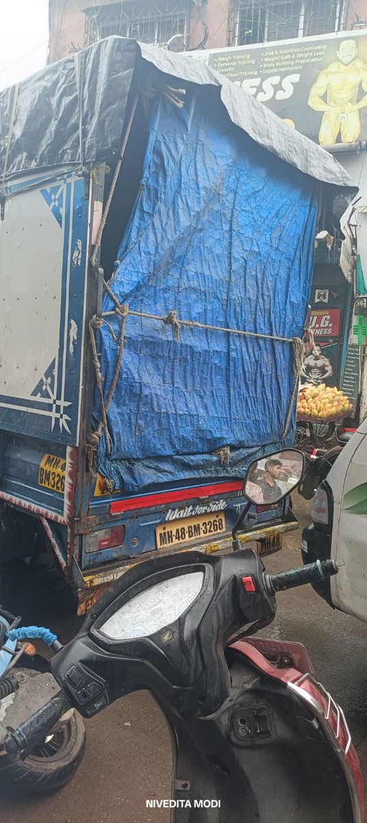 pmodi57's tweet photo. @MTPHereToHelp @MumbaiPolice A blue goods tempo bearing registration no. MH48BM3268 hit my parked scooter outside my shop and fled the spot without stopping. I have photographs of the vehicle and the incident. Requesting immediate action to trace the driver and take strict action https://t.co/QCDGzp1cFX