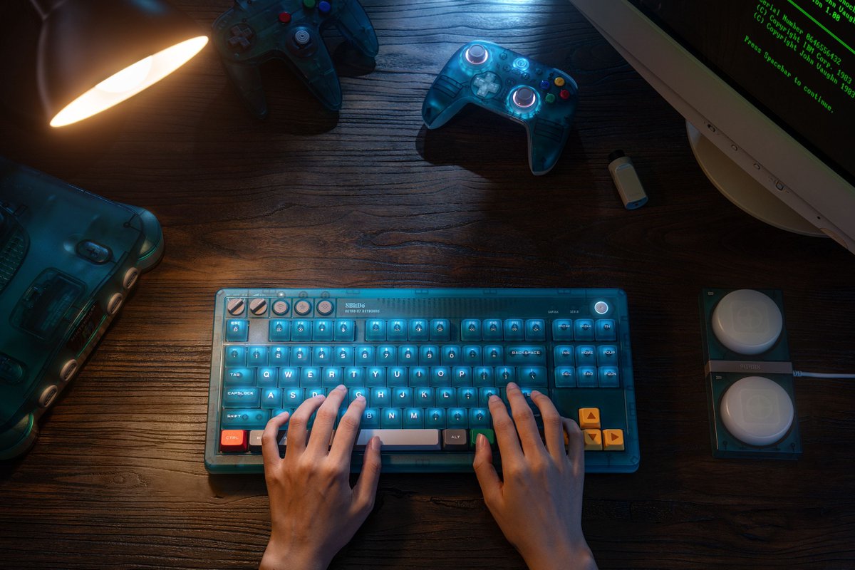 8BitDo's tweet photo. Introducing the 8BitDo N64 30th Collections: Ultimate 2 Wireless Controller & Retro 87 Mechanical Keyboard are now in Clear Blue.

A translucent Clear Blue finish, layered with timeless multi color accents—a tribute to 30 years of gaming history.

Clear Blue. Iconic Colors. 30 Years On.

Throwback now:
https://t.co/iOiPqOZgjt
https://t.co/J1O9m7pHPB

#8BitDo #Ultimate2 #Retro87 #Keyboard #PCsetup #N64