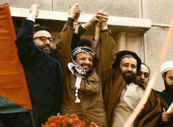 ramaxpert's tweet photo. Hey @Eyalo365 
kindly ask Azi (Azadeh Yazdi), proud grandchild of Ebrahim Yazdi, one of the cofounders of the islamic republic, pictured below, hand in hand with Arafat, who she works with in the US, lobbying for the regime day and night.  I can make life easier and answer for her: NIAC

Azi, sue me!