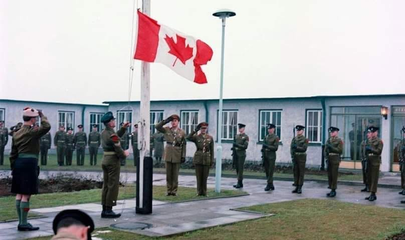 AdSewards's tweet photo. @CanadianAesth Canadian Maple Leaf flag being being raised for the first time, at Fort Henry in Northern Germany, 15 Feb 1965 . Your photo shows the lowering of the Canadian Red Ensign , then replaced by the new Canadian flag . https://t.co/T81o9euWtD