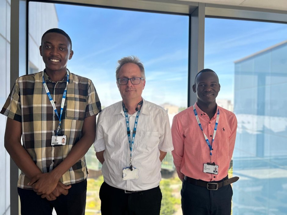 ICOMakchs's tweet photo. Avitus Agaruraho (left) and David Lufafa (right) fourth medical students  with  Dr Besser Martin Department of Haematology and Oncology Royal Papworth Hospital, Cambridge.  Cambridge University and Makerere University College of Health Sciences have had along-standing, robust academic partnership focused on global health research, capacity building, and clinical training. The two institutions operate a clinical rotation program that allows Makerere medical students to undertake observational clinical placements across diverse healthcare settings in Cambridge fully funded through  the cambridge-Africa Program.@Makerere_Medics @MakCHS_SOM @MakerereCHS @Alexkisakye2 @MarkKaddumark