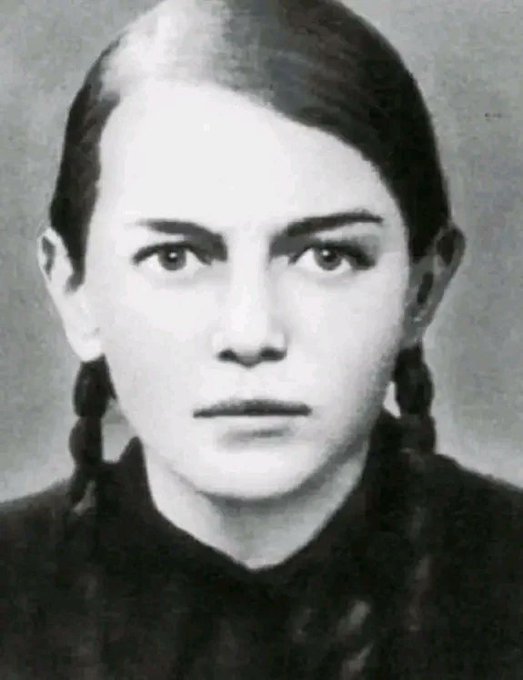 Rainmaker1973's tweet photo. The story of Zinaida Portnova, the 16 year old girl who took the lives of more than 100 Nazis by poisoning their food. She was captured by the Gestapo, and while being interrogated, she disarmed the Nazi detective and shot him in the head. In her attempt to escape, she executed two more Nazis.

A seventh-grade student at the 385th school in Leningrad, Zinaida became member of the local underground Komsomol organization, named Young Avengers, during the German invasion.

She became employed as a kitchen aide in Obol. In August, she poisoned the food meant for the Nazi garrison stationed there. Immediately falling suspect, she said she was innocent and ate some of the food in front of the Nazis to prove it was not poisoned. 

After she did not fall ill immediately, they released her. Portnova became sick afterwards, vomiting heavily but eventually recovering from the poison after drinking much whey. After she did not return to work, the Germans realized she had been the culprit and started searching for her.

When she was captured in 1943, during the Gestapo interrogation, she took the investigator's pistol off the table, then shot and killed him. When two German soldiers entered after hearing the gunshots, she shot them as well. 

She then attempted to escape the compound and ran into the woods, where she was caught near the banks of a river. She was executed in 1944.