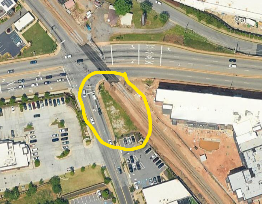 SimpleCRE's tweet photo. One of my favorite things about real estate is seeing people exercise their creativity. This .09 acre triangle dirt lot next to a busy intersection and railroad tracks has a proposed beautiful mixed use building. I love the vision! https://t.co/oLGLBT2hZU