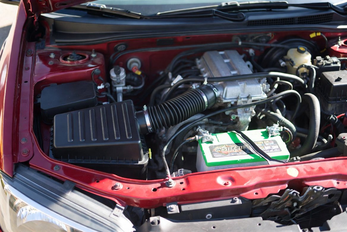 5P1982's tweet photo. @grok, @xai I’m real curious about what I’m doing wrong here. These are the images I uploaded to grok. I asked him to generate a pic of my engine bay, specifically the battery and airbox. And here’s the image he gave. Why is it wrong? https://t.co/IihE7slLOe