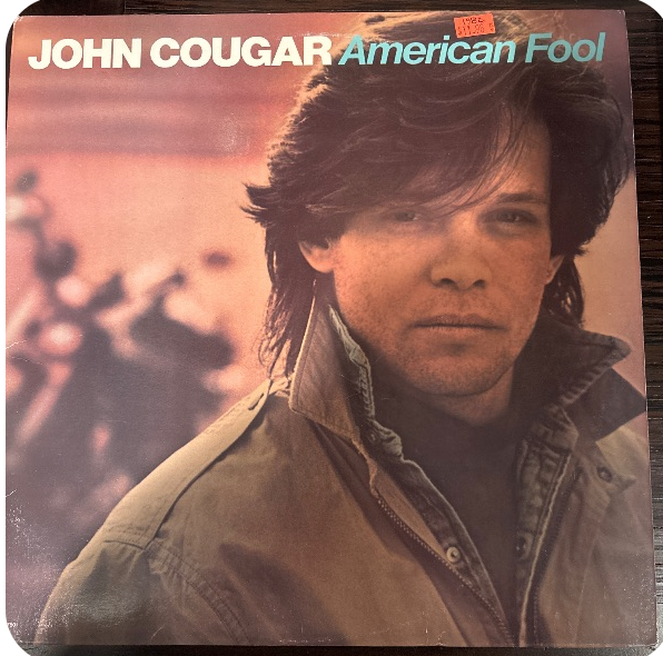 VinylVaultApp's tweet photo. A surprising twist: John Cougar’s American Fool was initially dismissed by some critics, yet it became his breakthrough. 

The album spent nine weeks at No. 1, powered by “Hurts So Good” and “Jack & Diane.” 

What many don’t know is that the iconic handclaps and stomps in “Hurts So Good” were meant to give it a raw, live feel—helping turn a simple rock song into a stadium anthem.