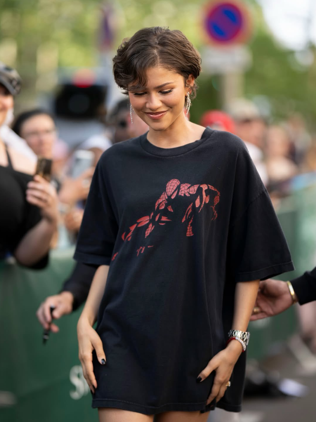 MagaliDMathias's tweet photo. zendaya wearing a 2007 spider-man marvel t-shirt and louboutin So Kate heels on her way to the "SPIDER-MAN: BRAND NEW DAY" fan event in paris. https://t.co/BI39MXGxuL